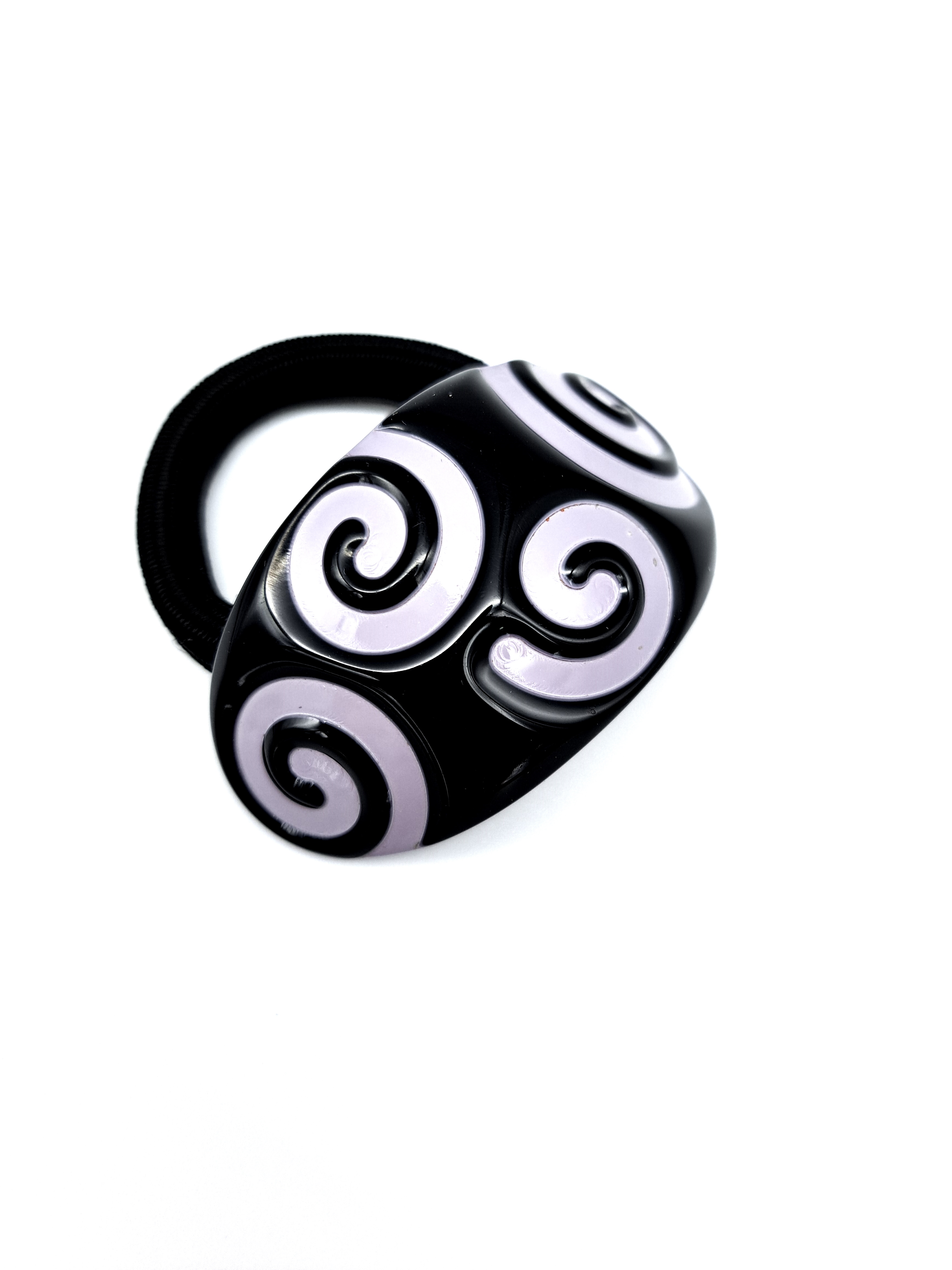 Haargummi mit Spange in Schwarz mit Spiralen in Flieder